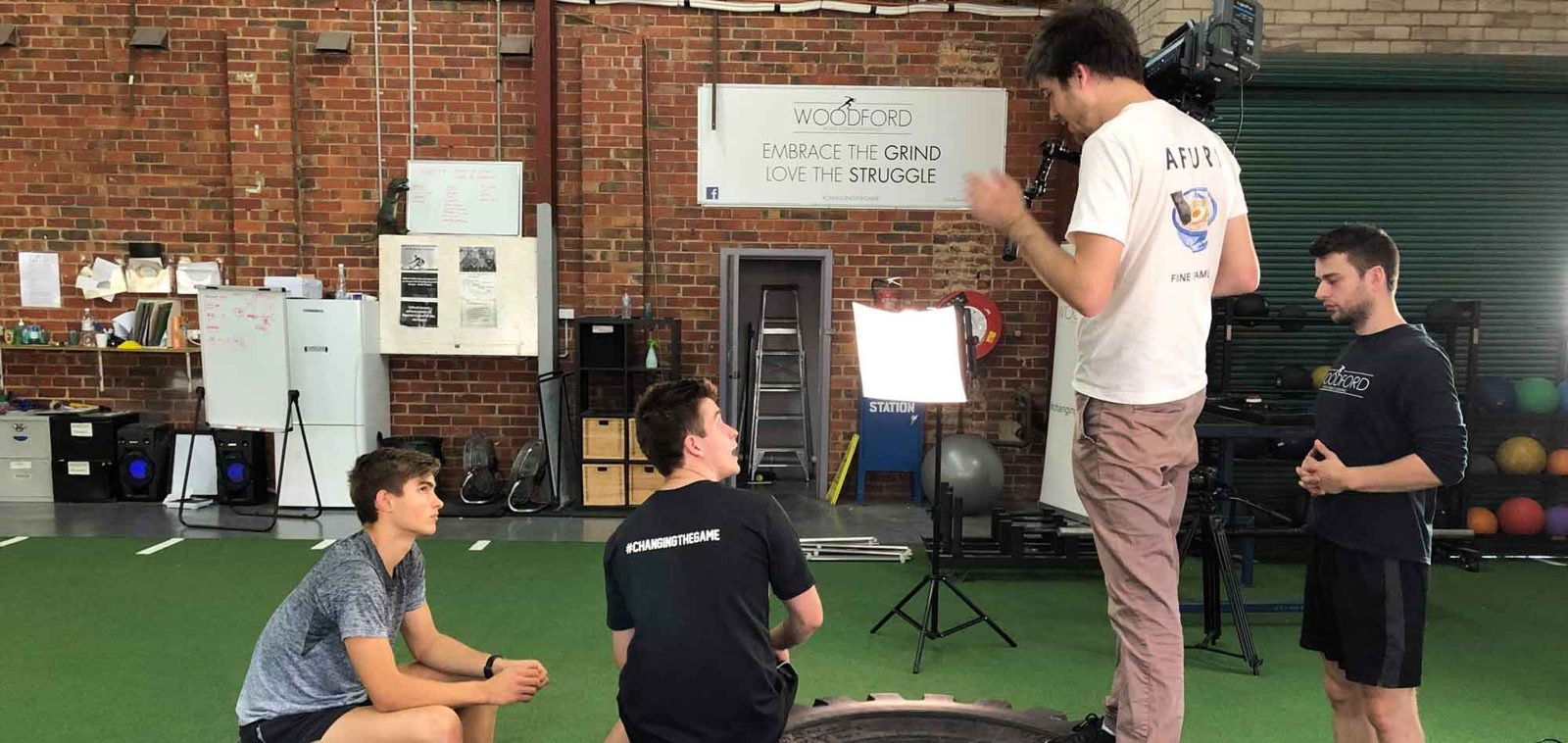 Filming an interview at a training gym